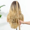 Back view of blonde ombre wig showing layered length