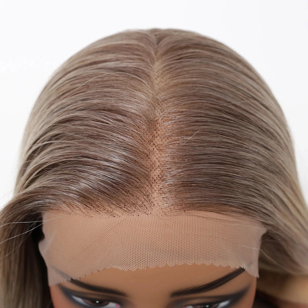 Close-up of a wig with a lace front on a white background