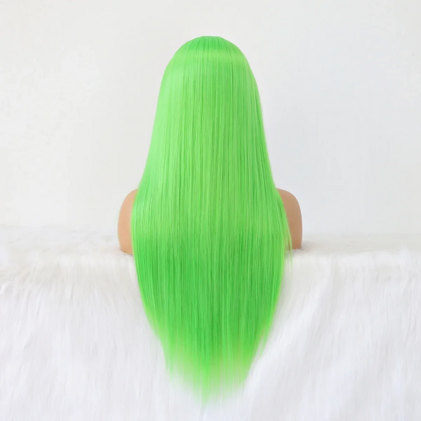 Green wig on a mannequin head against a white background