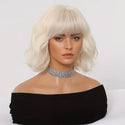 Lifelike synthetic blonde wig styled with layered waves and full fringe