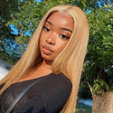 Woman wearing Long Blonde Human Hair Wigs with greenery in the background