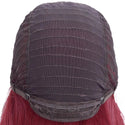 Back view of a wig with red hair and a dark brown lace front on a white background