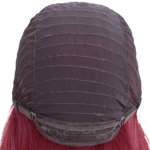 Back view of a wig with red hair and a dark brown lace front on a white background
