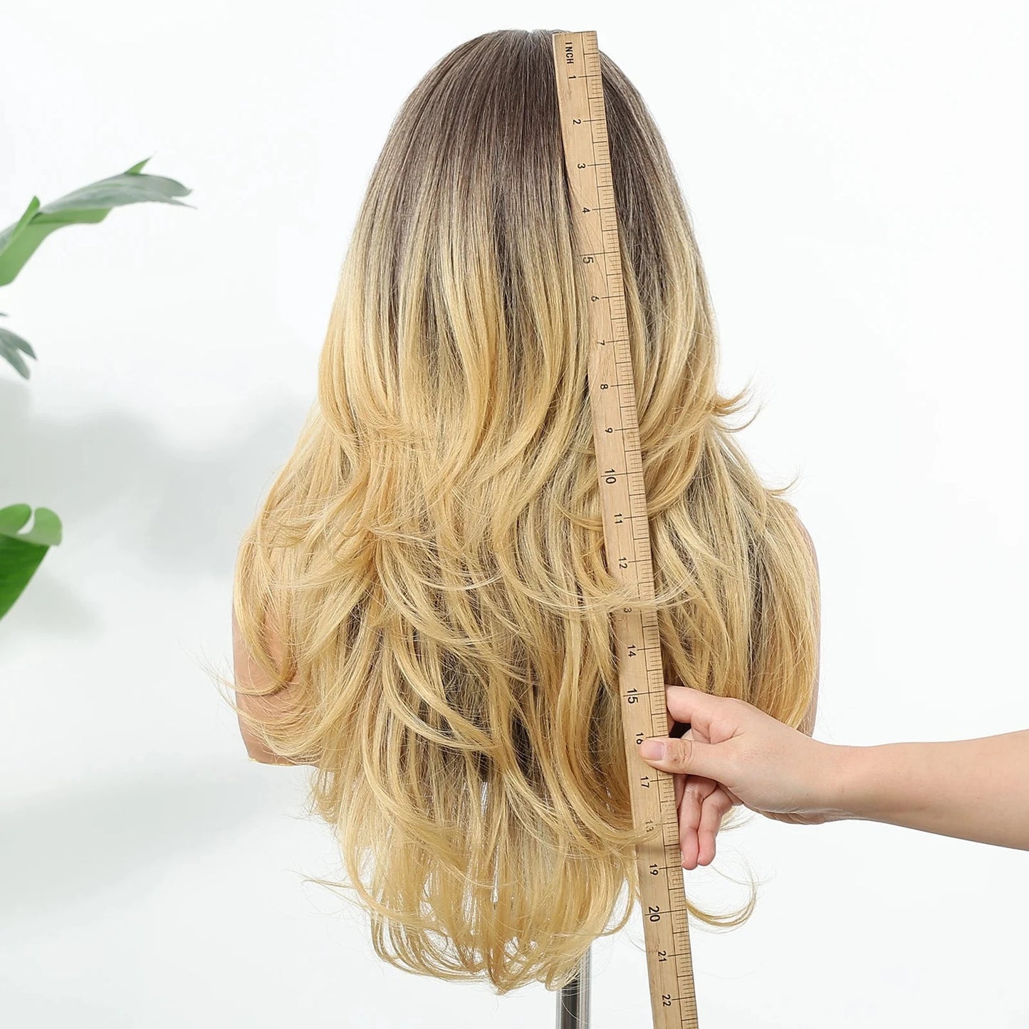Back view of blonde ombre wig showing layered length