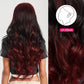 Back view of long red and black glueless wig with loose curls