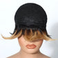 Black and brown ombre wig on a mannequin head with a white background