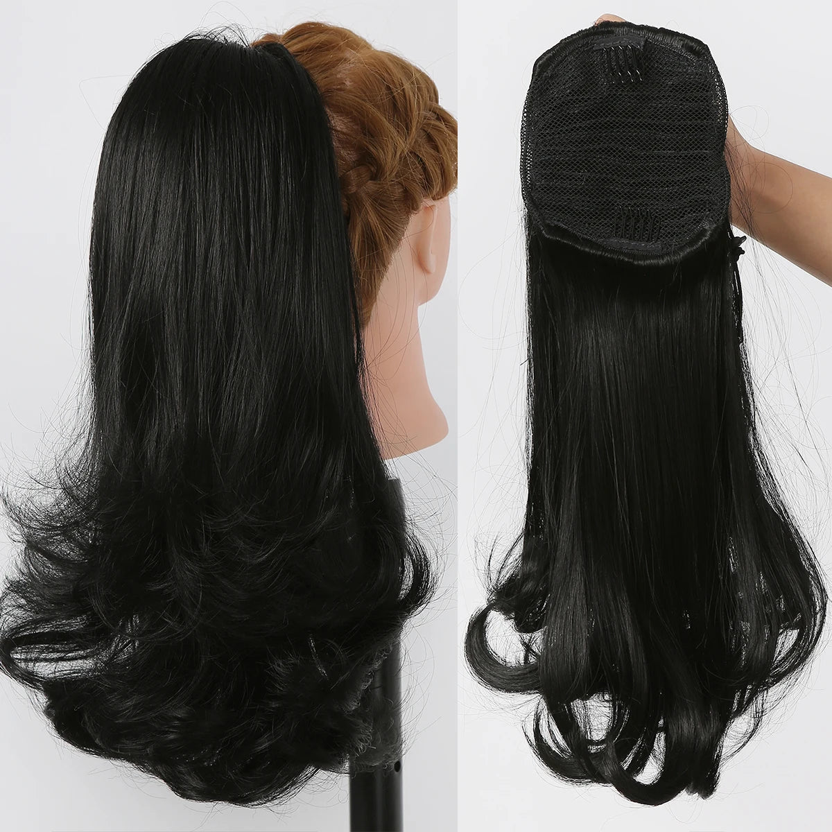 Black hair extension on a mannequin head and held by a hand against a white background.