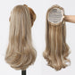 Blonde hair extension displayed on a mannequin head with a white background