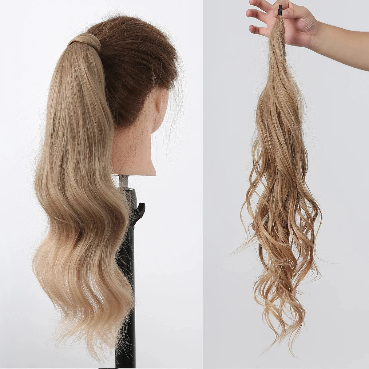 Blonde ponytail extension on a mannequin head and held by a hand against a white background