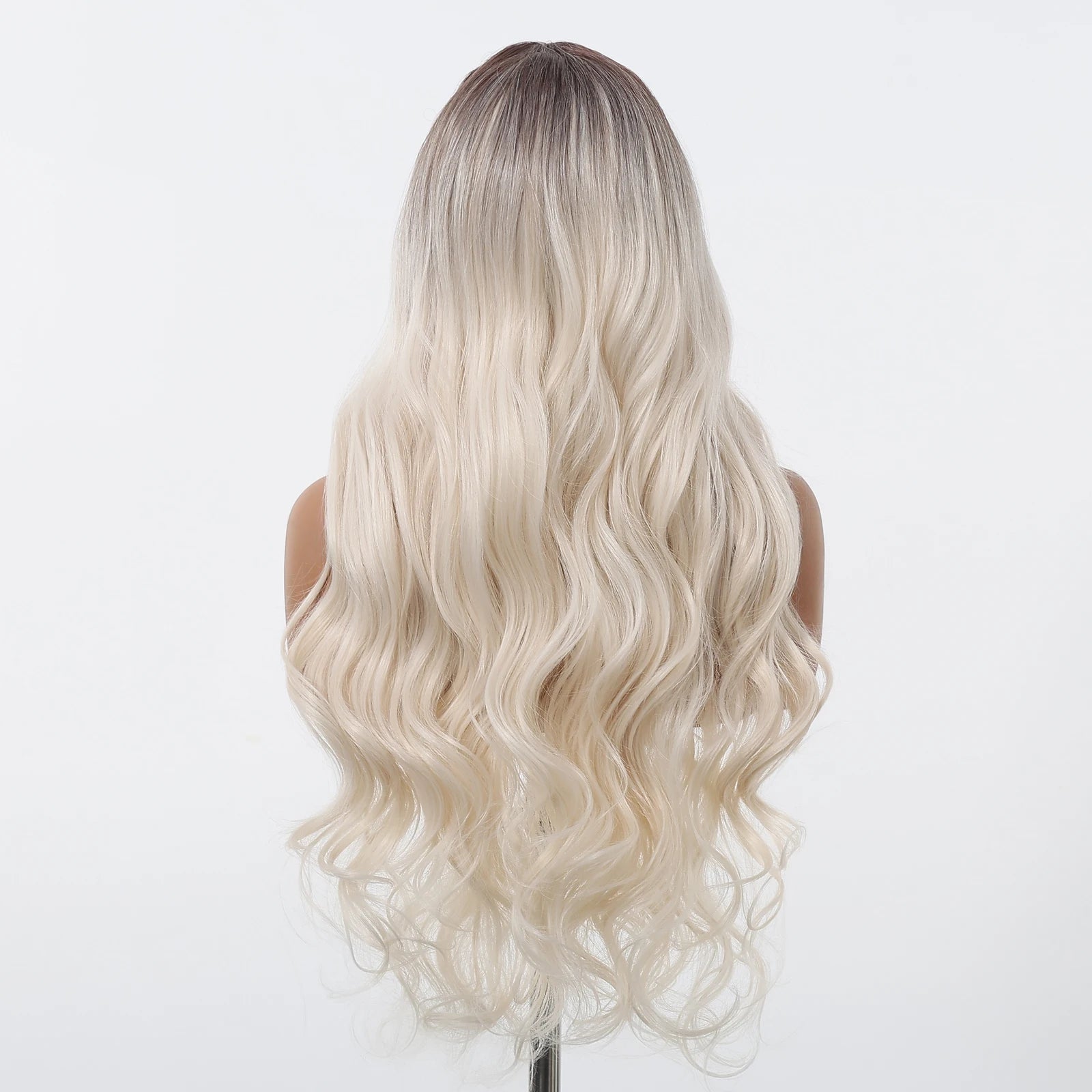 Blonde wig with wavy hair on a mannequin head against a white background
