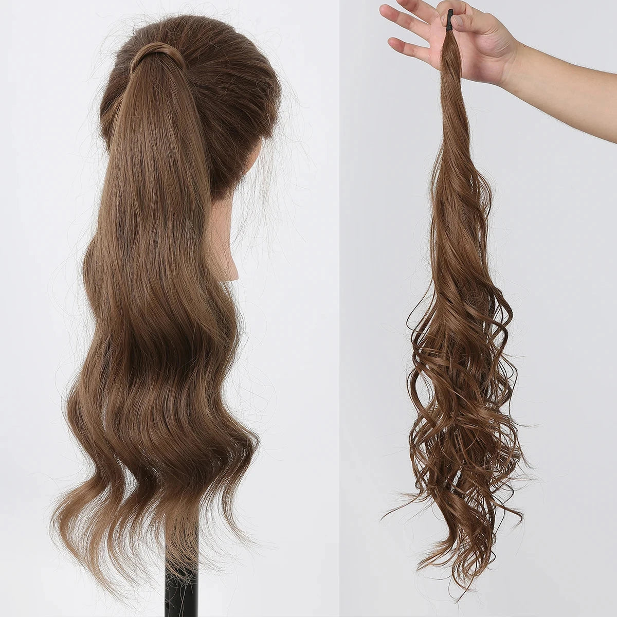 Brown hair extension on a mannequin head and held by a hand against a white background
