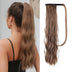 Brown hair ponytail extension worn by a person and shown in a close-up on a white background.