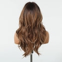 Brown wig on a mannequin head against a white background