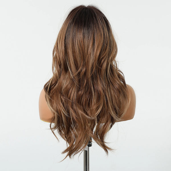 Brown wig on a mannequin head against a white background