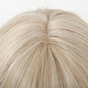Close-up of a blonde wig on a white background