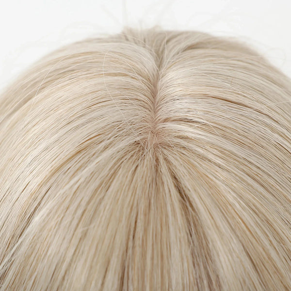 Close-up of a blonde wig on a white background