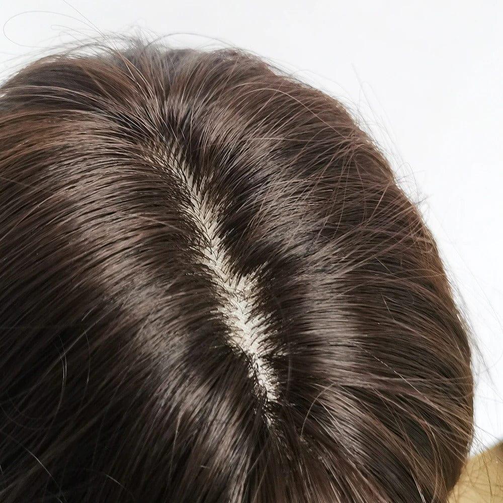 Close-up of a brown hairpiece wig  on a white background