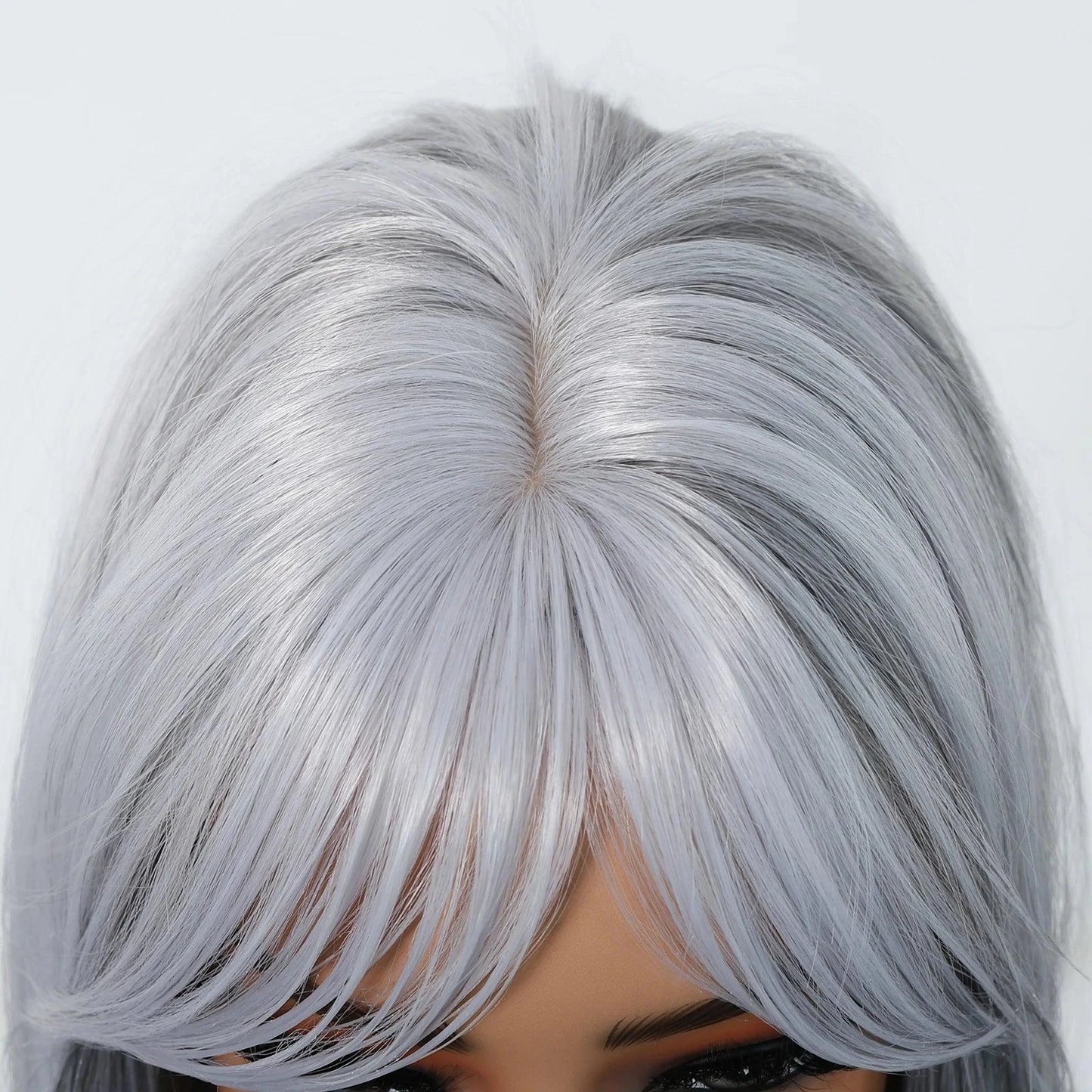 Close-up of a silver wig hairline on a white background