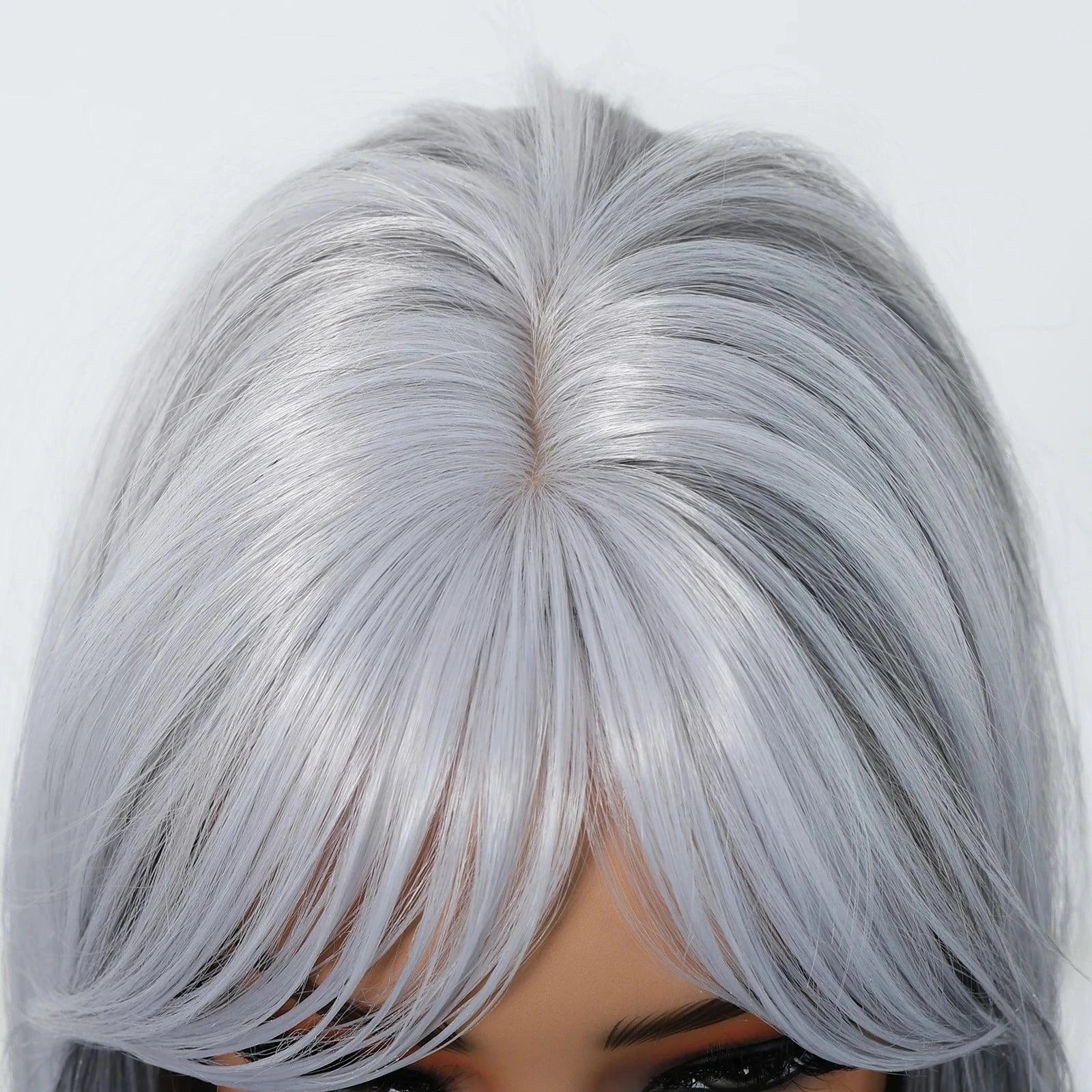 Close-up of a silver wig hairline on a white background