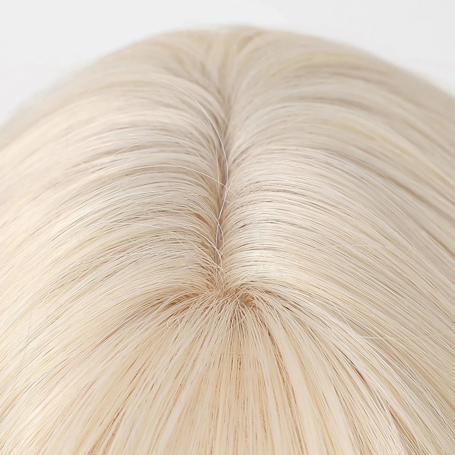 Close-up of blonde synthetic wig hairline and parting