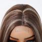 Close-up of brown wig parting for realistic scalp effect