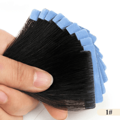 Hand holding a set of black hair extensions against a white background
