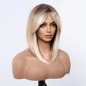 Mannequin head with a blonde wig on a white background