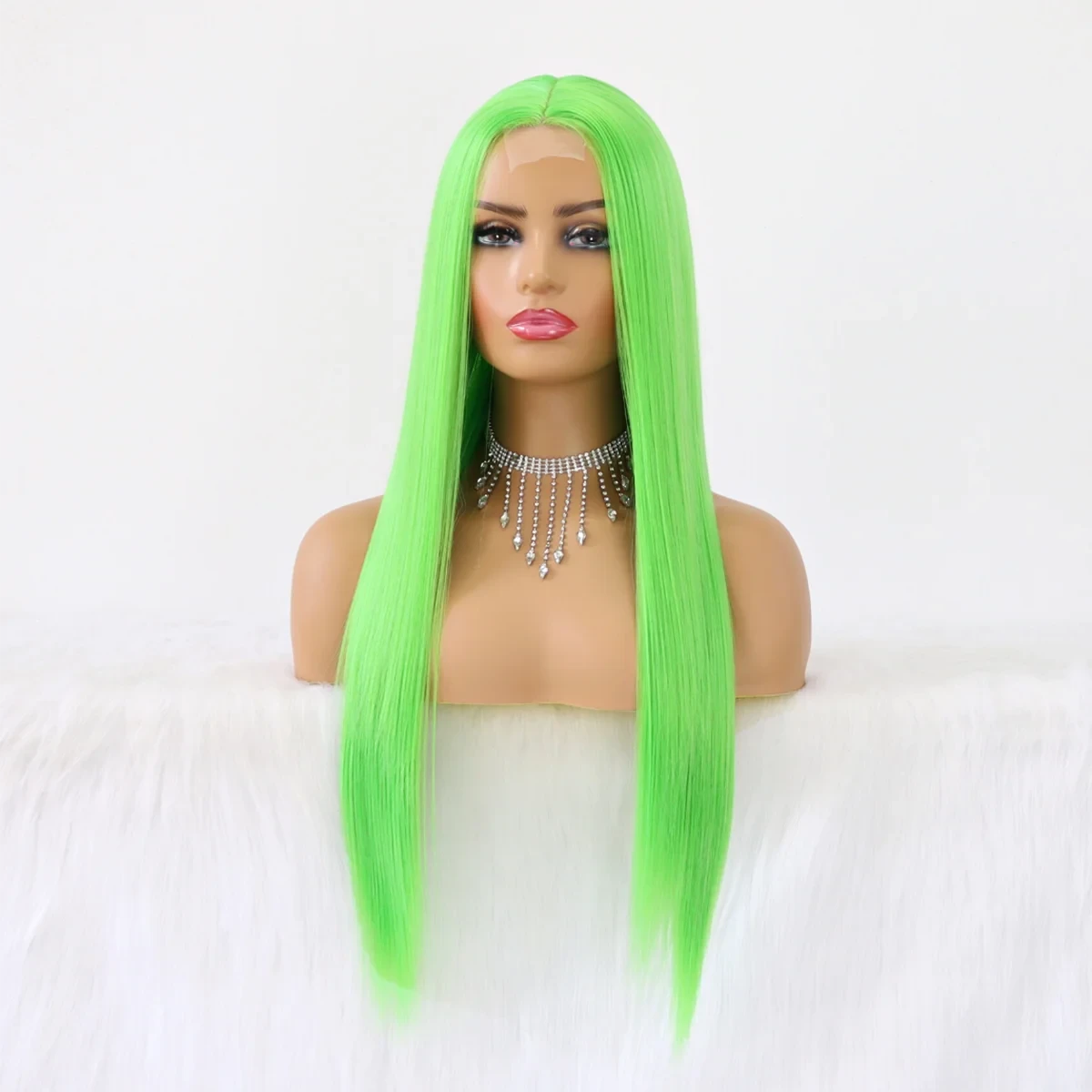 Mannequin head with a bright green wig on a white background