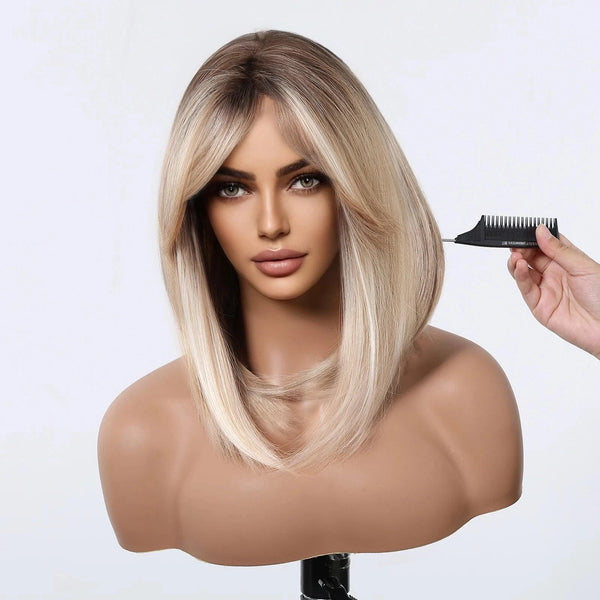 Mannequin head with blonde wig bob being styled with a comb on a white background