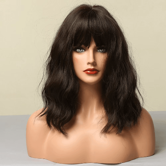 Mannequin head with dark brown wig on a neutral background