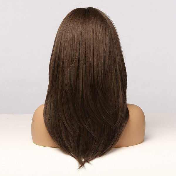 Mannequin head with long brown hair wig on a white background
