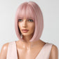 Mannequin head with pink bob wig on a white background