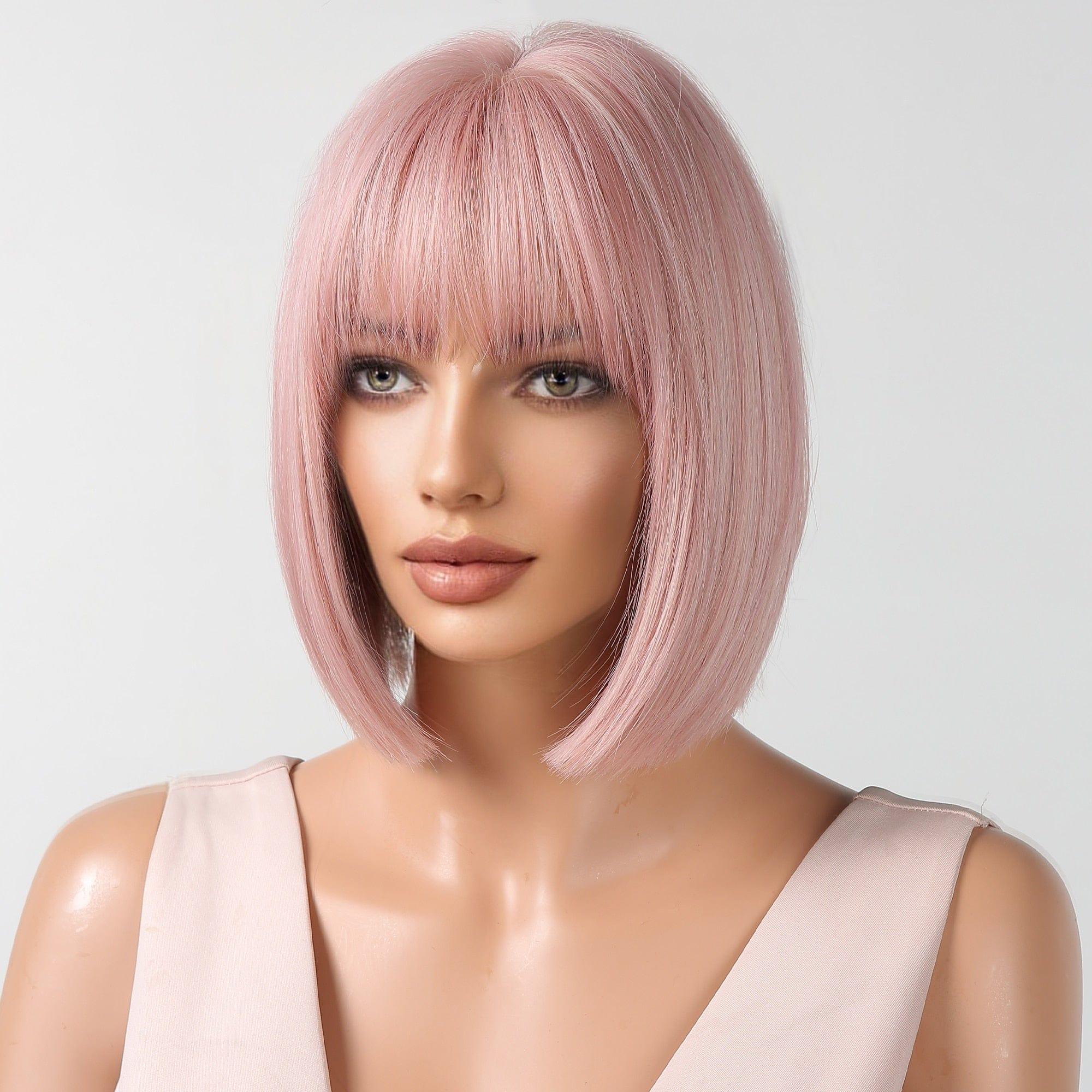 Mannequin head with pink bob wig on a white background