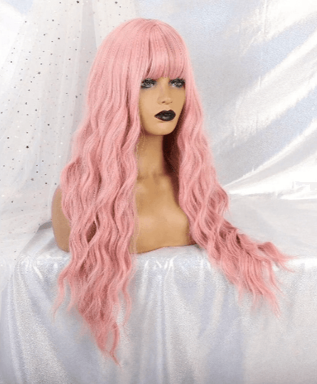 Mannequin head with pink wig on a white background