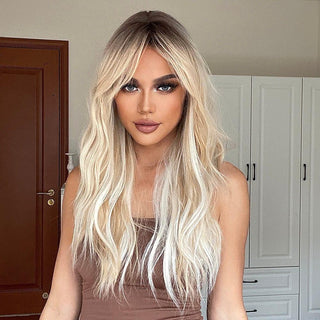 Model wearing beachy bleach blonde curly wig with realistic texture