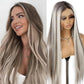 Model wearing gray brown synthetic wig styled straight