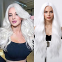 Model wearing long wavy white wig – bleach white synthetic wig styled with soft waves and middle part