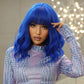 Model wearing royal blue wig with bold makeup look