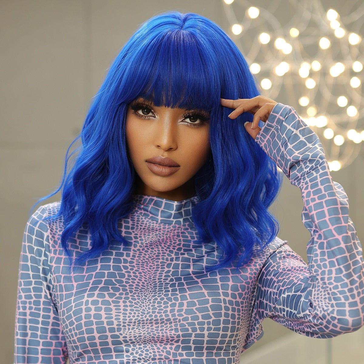 Model wearing royal blue wig with bold makeup look