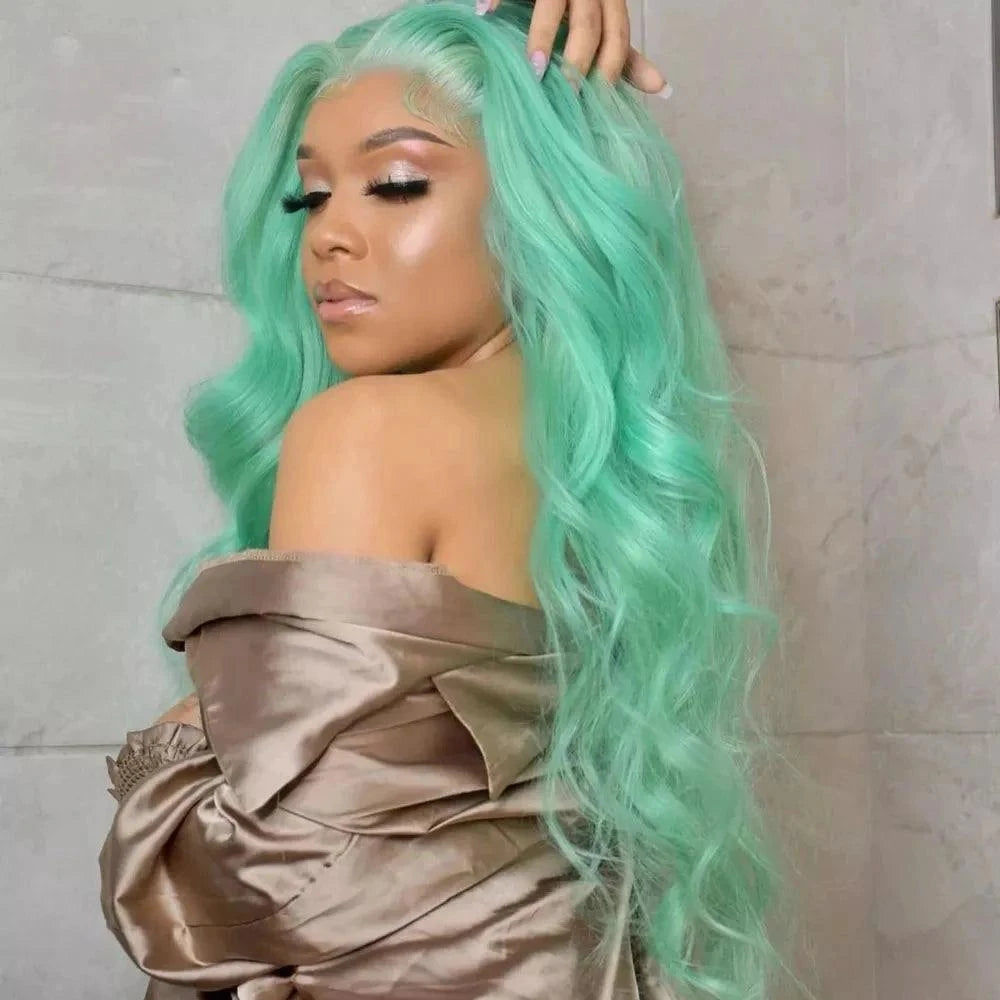 Person with a Green Wig styled in waves, wearing a beige off-shoulder top against a neutral background.