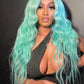 Person with a Mint Green Wig wearing a black top against a dark background