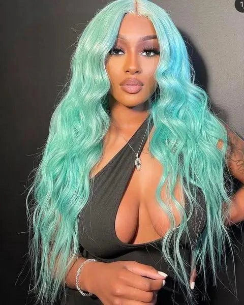 Person with a Mint Green Wig wearing a black top against a dark background