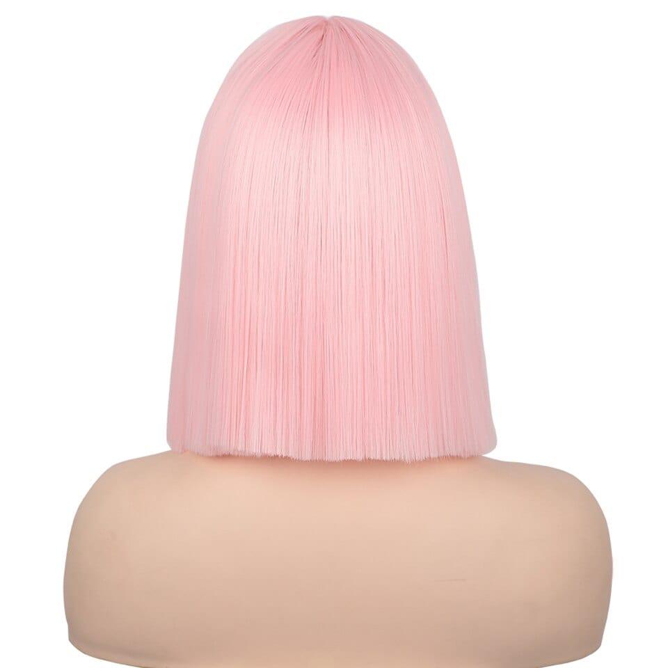 Pink wig on a mannequin head against a white background