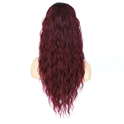 Red ponytail extension on a mannequin head against a white background