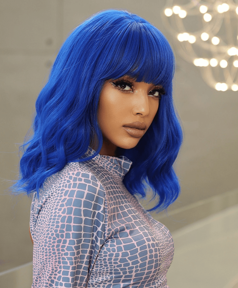 Side profile of vibrant blue wig showing wavy cut