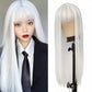 White wig on a mannequin head next to a person wearing the wig.