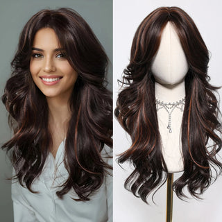 Woman with a burgundy brown wig next to a wig on a mannequin head.