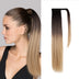 Woman with a ponytail wearing a hair extension on a gray background
