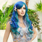 Woman with blue and green wig wearing a starfish hair accessory in a garden setting