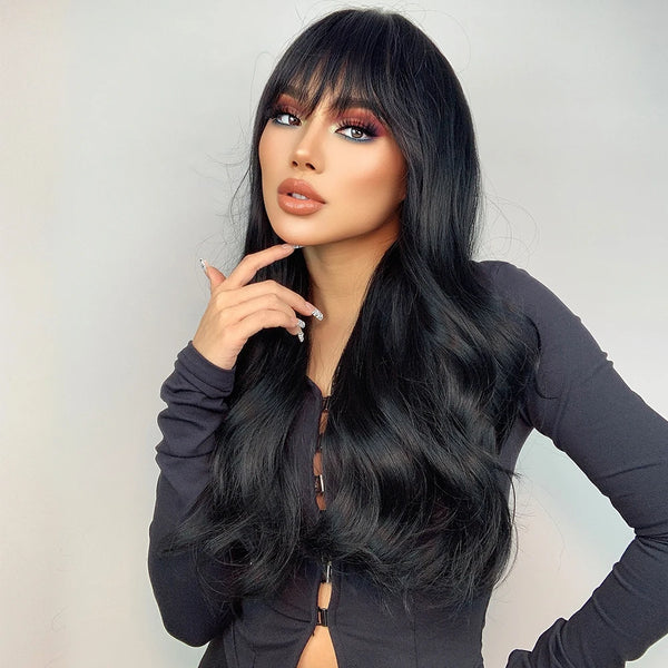 Woman with long black hair wig and stylish makeup against a plain background